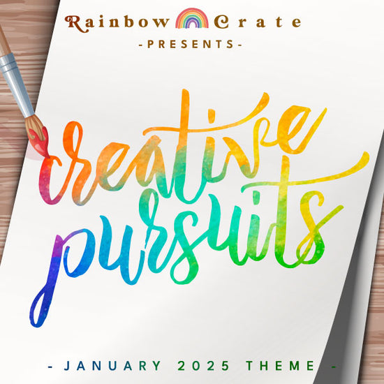 A graphic of a white piece of paper sitting on a wooden desk with a brush painting the words “creative pursuits” in rainbow ink across it. At the top is 