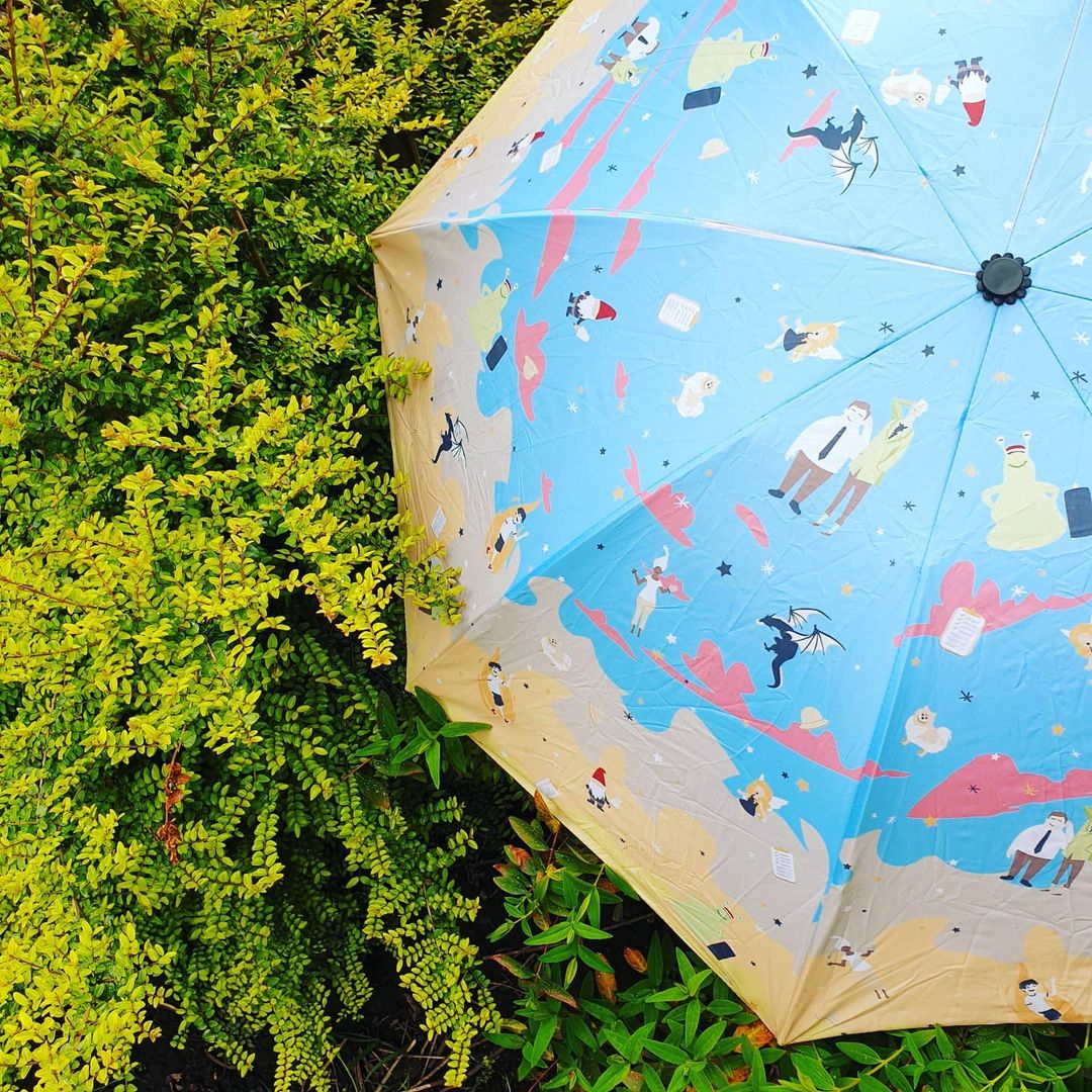 Our House in the Cerulean Sea umbrella on some greenery
